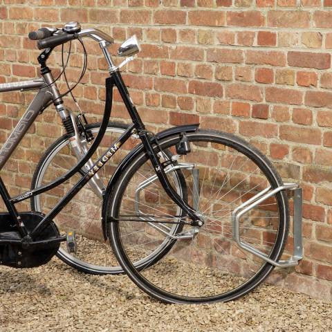 Adjustable wall garage for bicycles